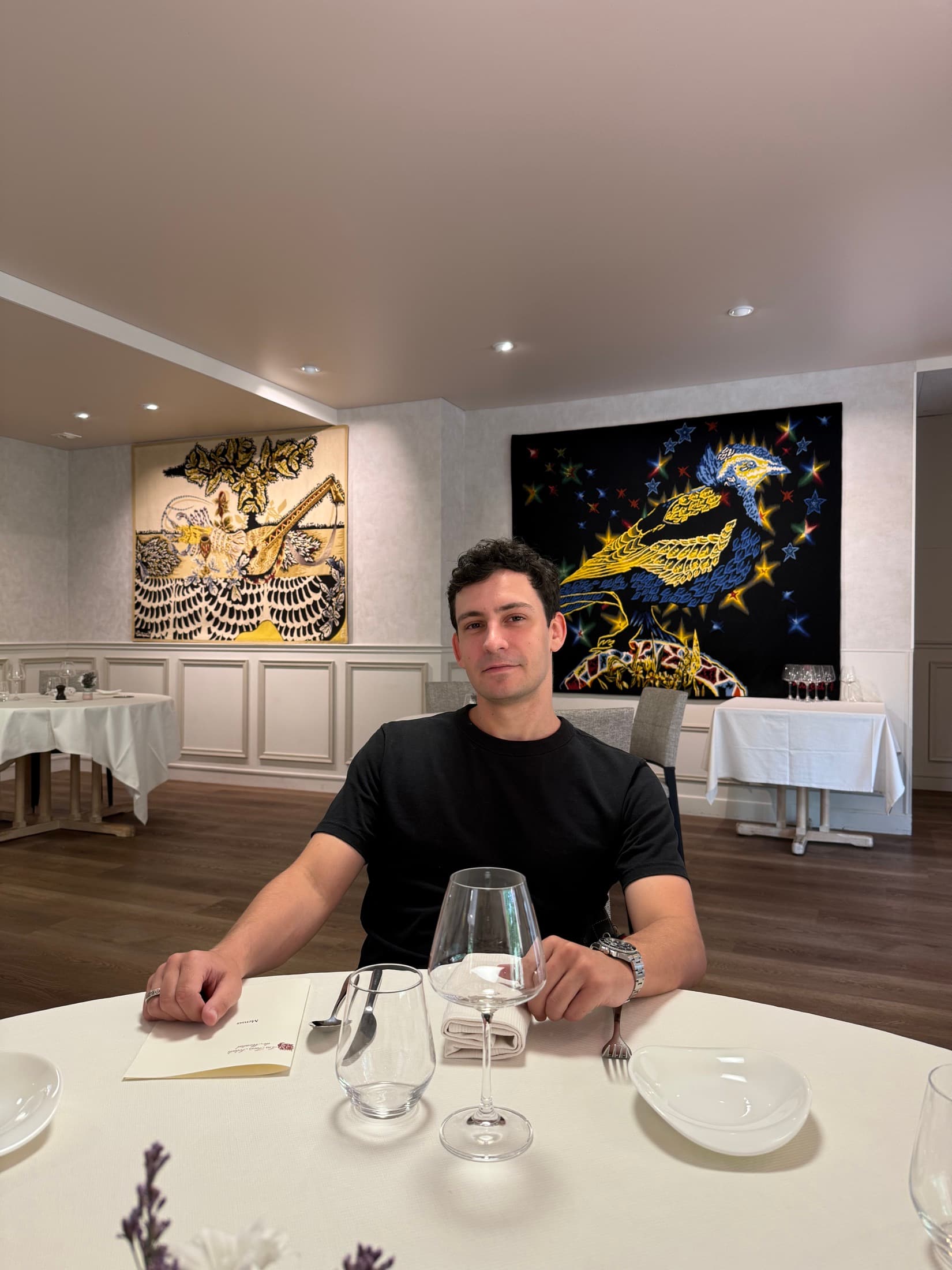 Adrien Soulié seated at a restaurant table